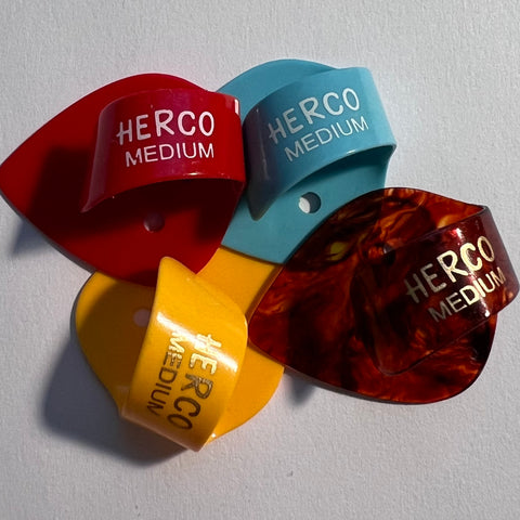 Herco Flat Thumbpick, HE112, Medium, Pkg of 4, Assorted Colors
